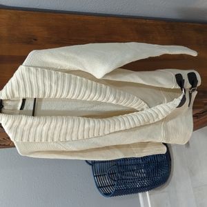 Tunic length sweater with buckle details